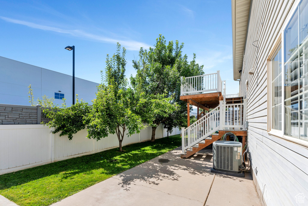 Fenced backyard with a patio and stairway