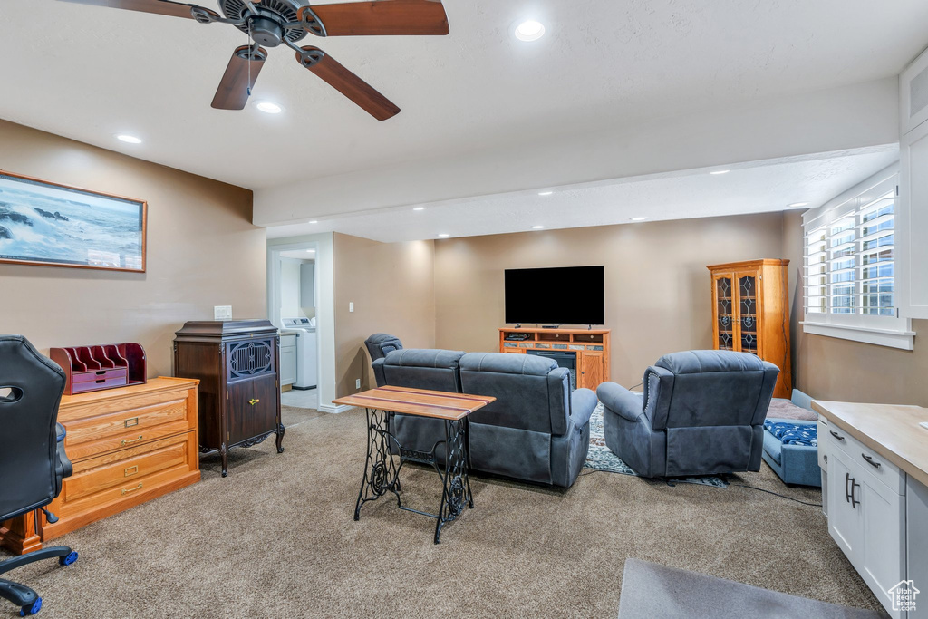 Living room featuring light colored carpet, recessed lighting, and ceiling fan