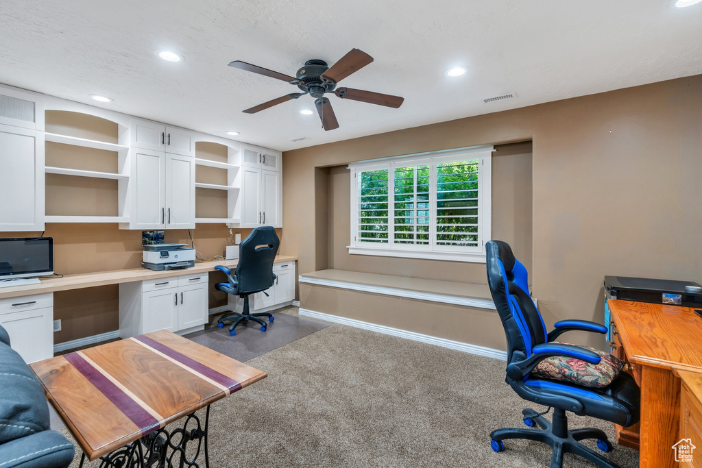 Home office with recessed lighting, ceiling fan, and built in desk