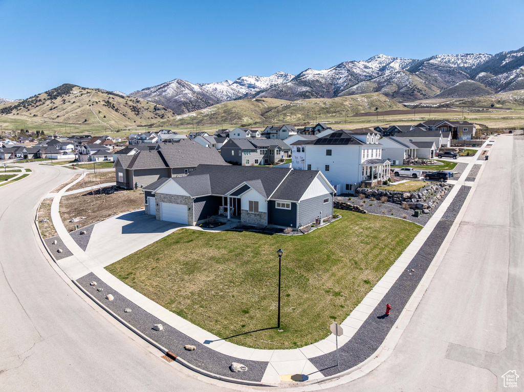Aerial view of residential area with a mountainous background