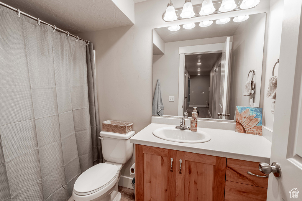 Full bathroom with vanity and a shower with shower curtain