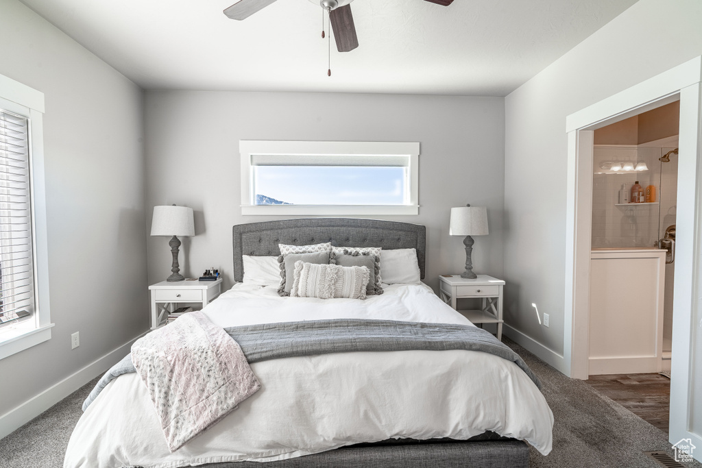 Carpeted bedroom featuring baseboards and a ceiling fan