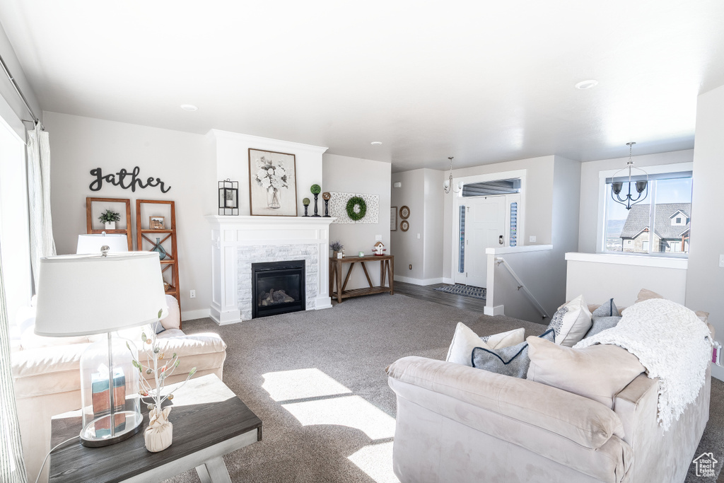 Living room with carpet and a glass covered fireplace