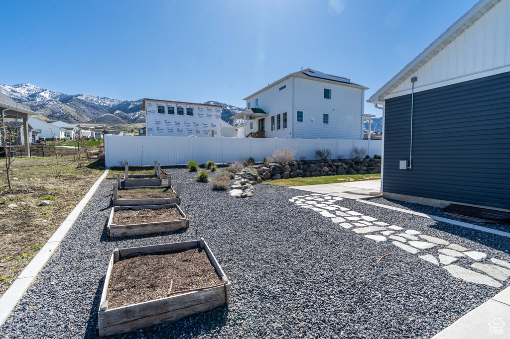 View of yard with a garden and a mountain view