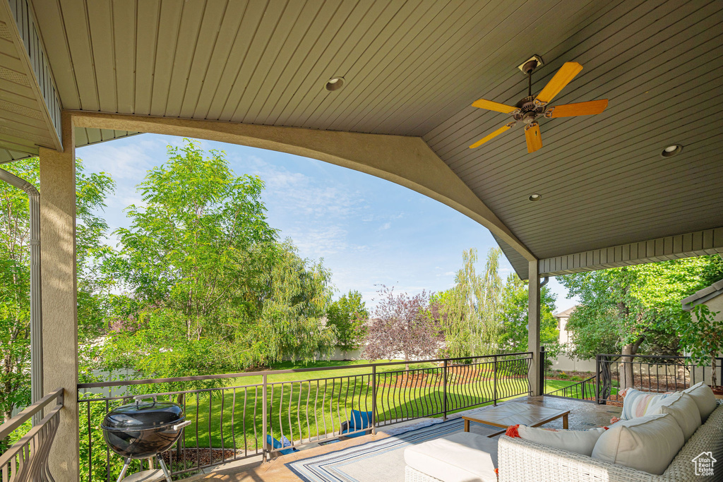 View of patio / terrace with outdoor lounge area, ceiling fan, and a deck