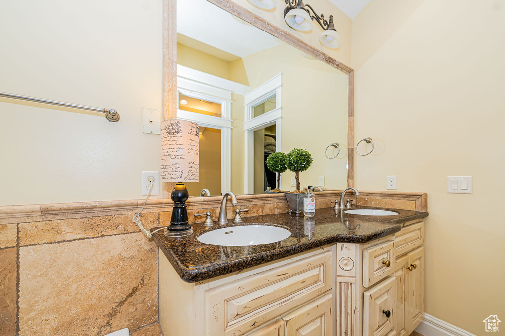 Bathroom featuring double vanity