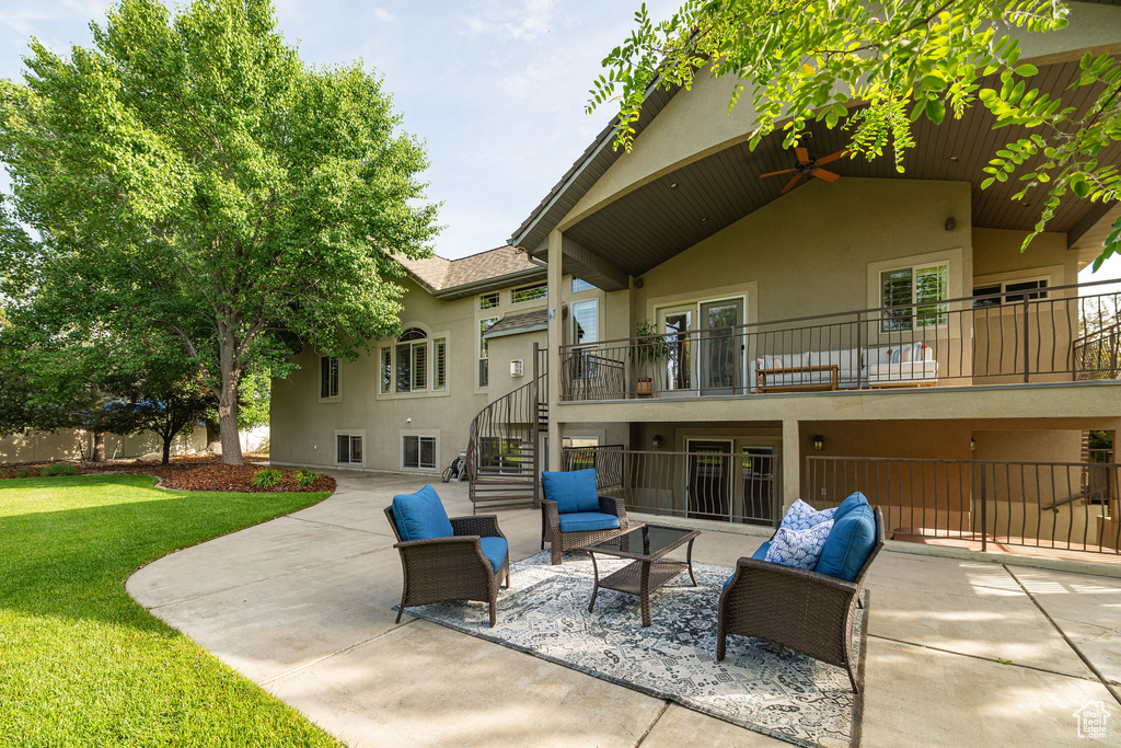 View of patio featuring stairway and outdoor lounge area