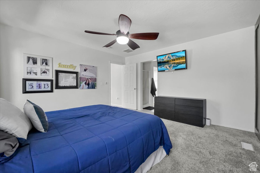 Bedroom featuring carpet flooring and ceiling fan