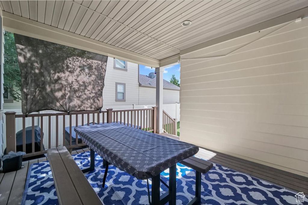 Wooden terrace featuring outdoor dining space