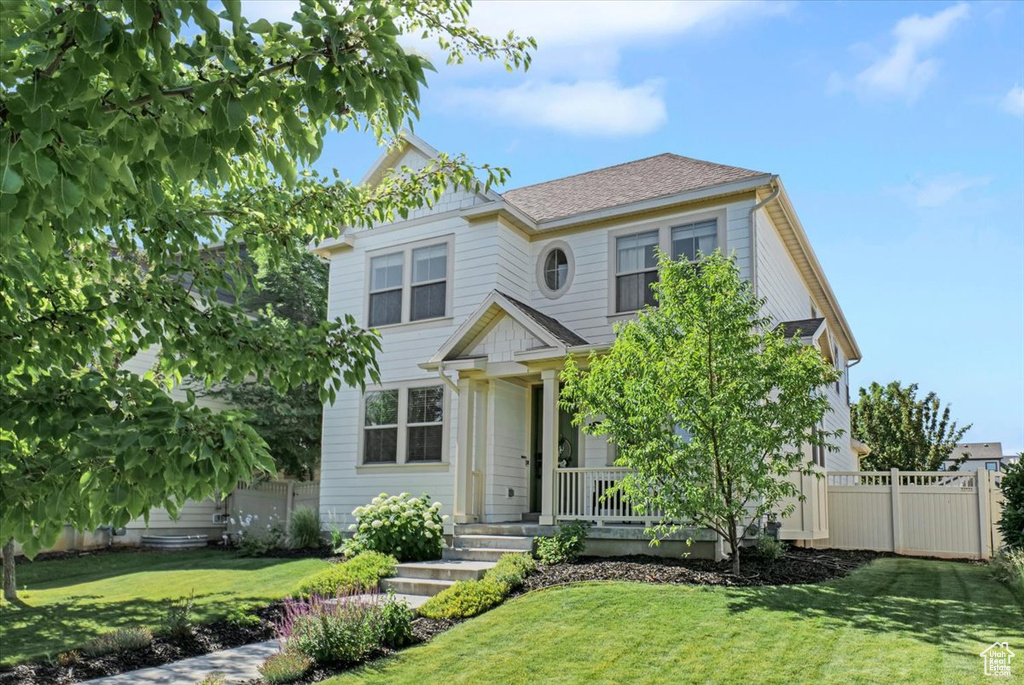View of front of house featuring a porch and a shingled roof