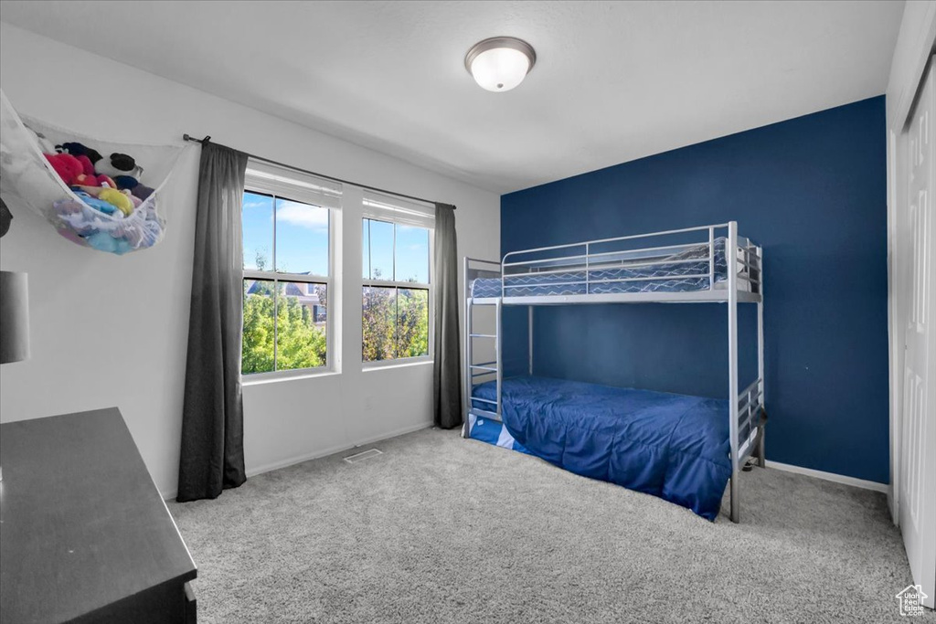 Unfurnished bedroom with carpet