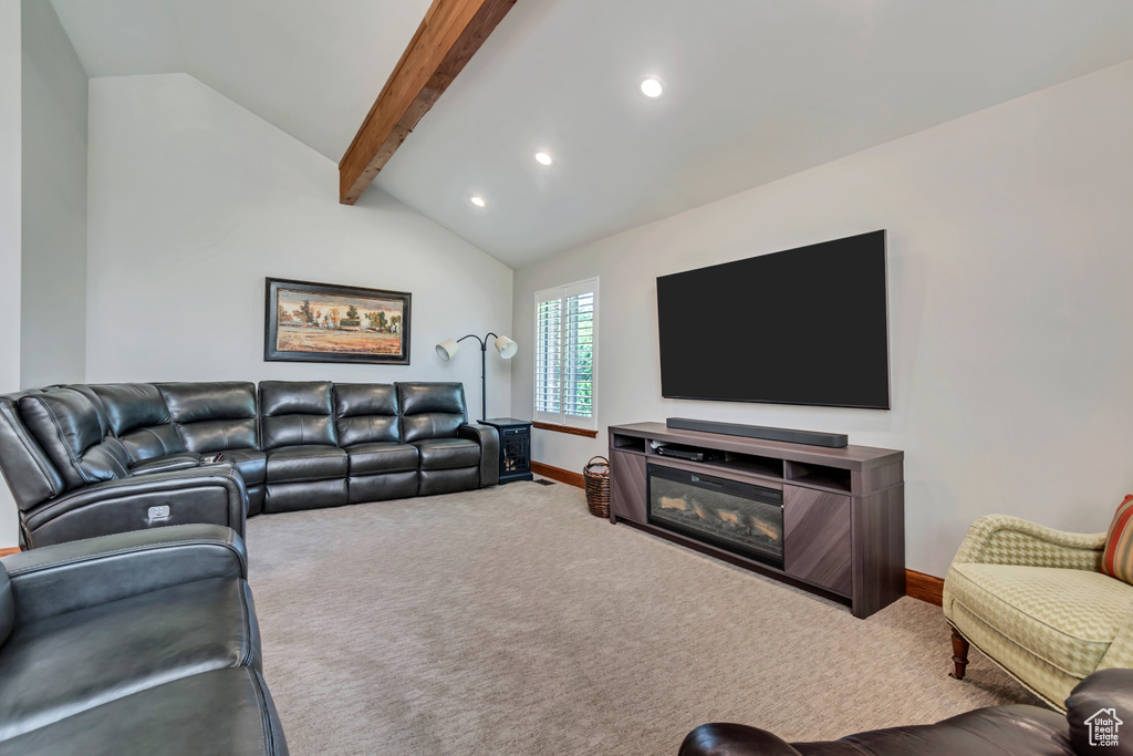 Carpeted living room with baseboards and recessed lighting