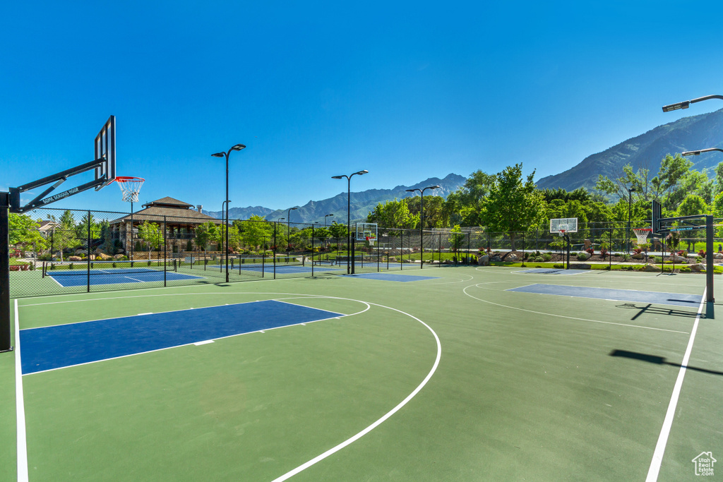 View of sport court with community basketball court and a mountain view