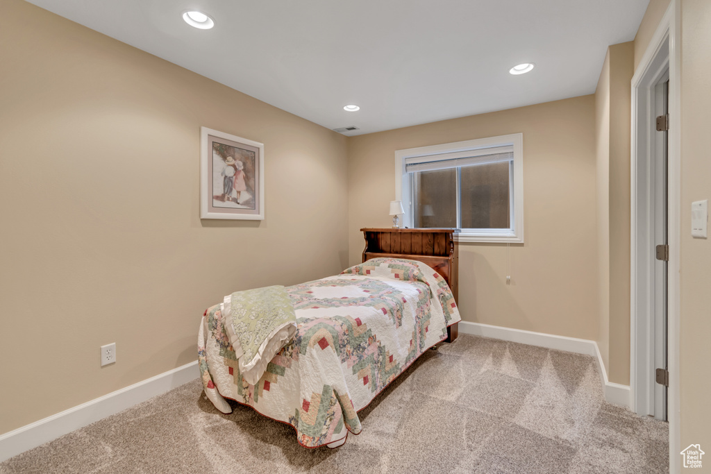 Carpeted bedroom featuring baseboards and recessed lighting