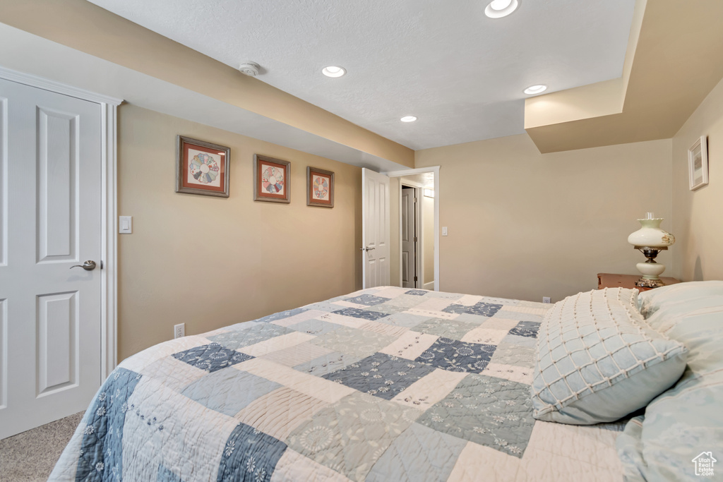 Bedroom with recessed lighting and carpet