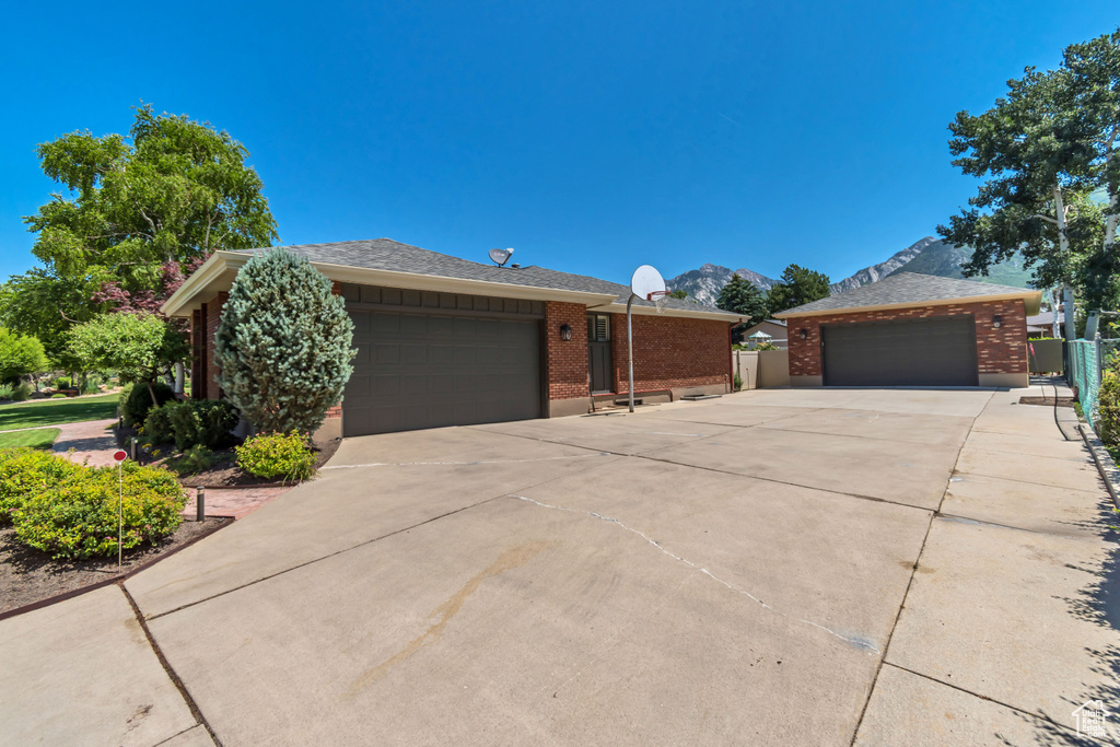 Single story home with brick siding and a garage