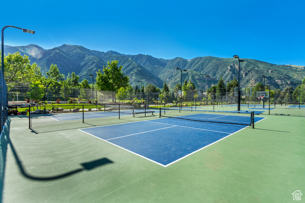 View of tennis court featuring a mountain view