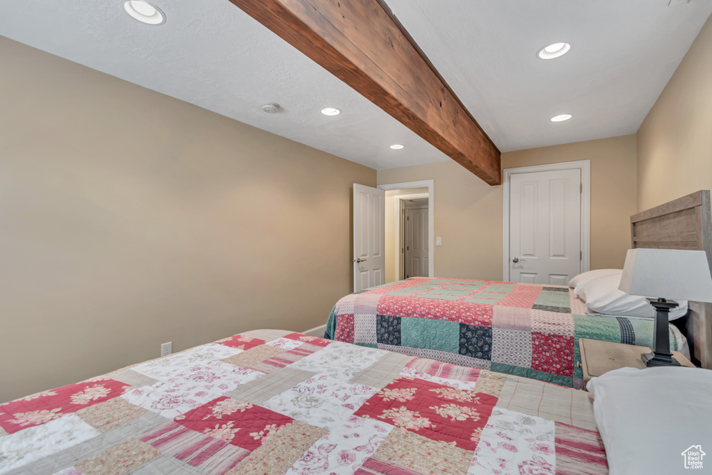 Bedroom featuring recessed lighting and beamed ceiling