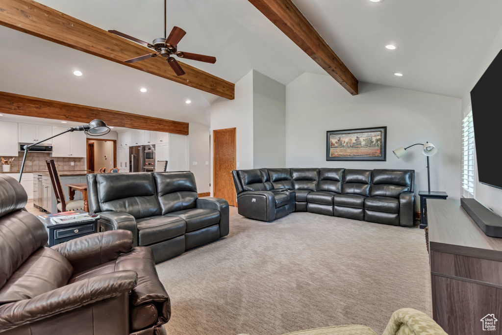 Carpeted living area featuring recessed lighting and a ceiling fan