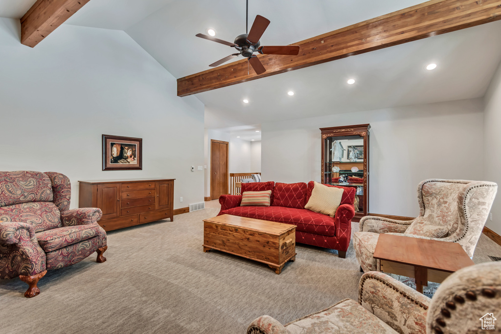 Living room with carpet flooring, beam ceiling, a ceiling fan, recessed lighting, and high vaulted ceiling