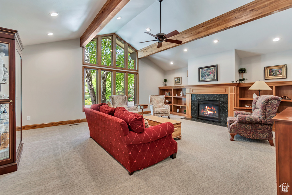 Living room featuring carpet floors, recessed lighting, a ceiling fan, and a premium fireplace