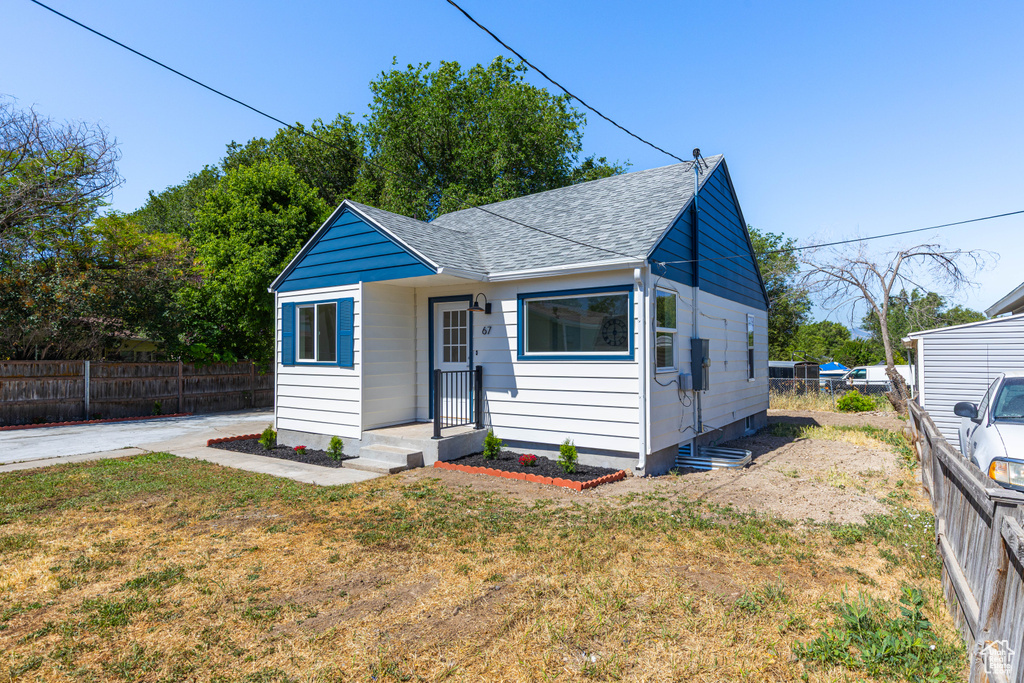 Bungalow-style home featuring a shingled roof