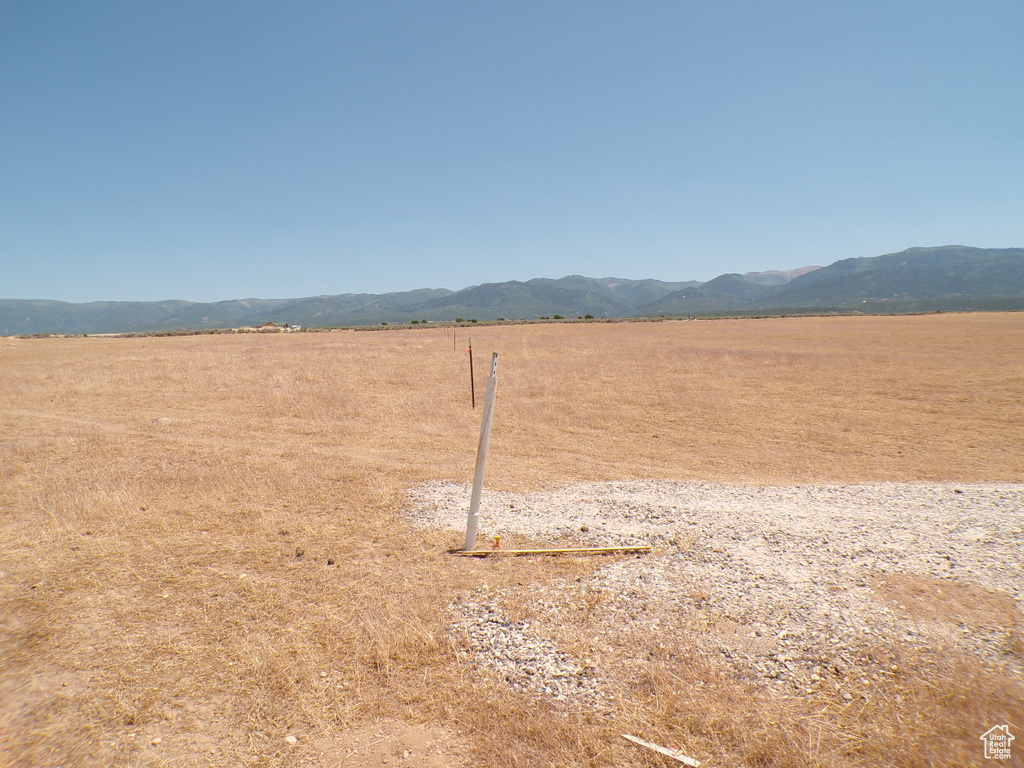 View of yard featuring a view of countryside and a mountain view