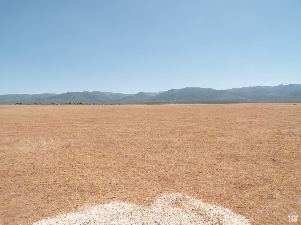 View of mountain backdrop with rural landscape