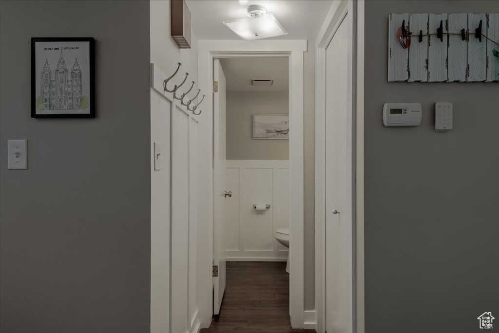 Hall with dark wood-type flooring