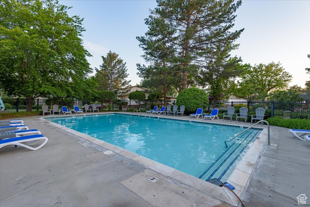 Community pool featuring a patio