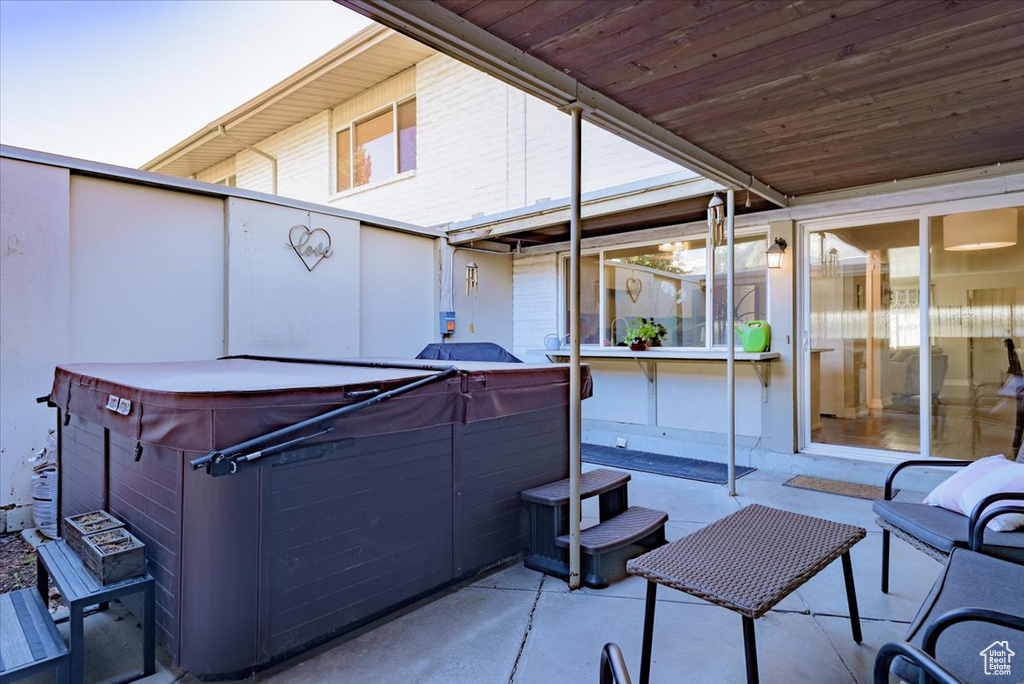 View of patio / terrace featuring a hot tub