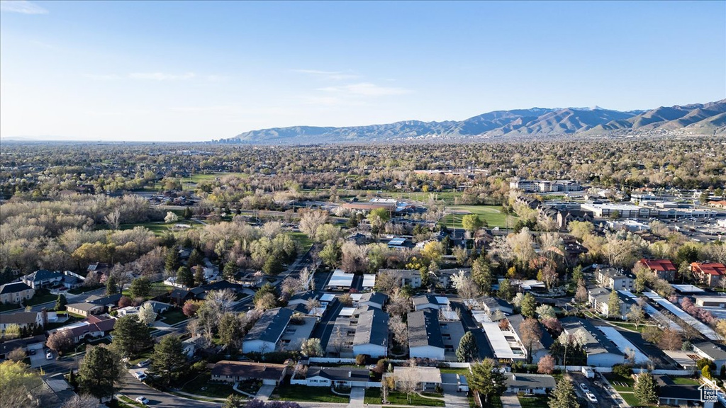 Aerial perspective of suburban area with a mountain backdrop