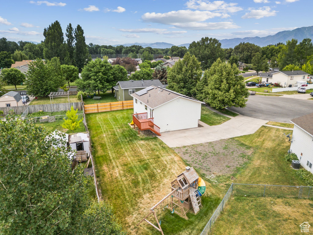 Aerial view of residential area featuring a mountain backdrop