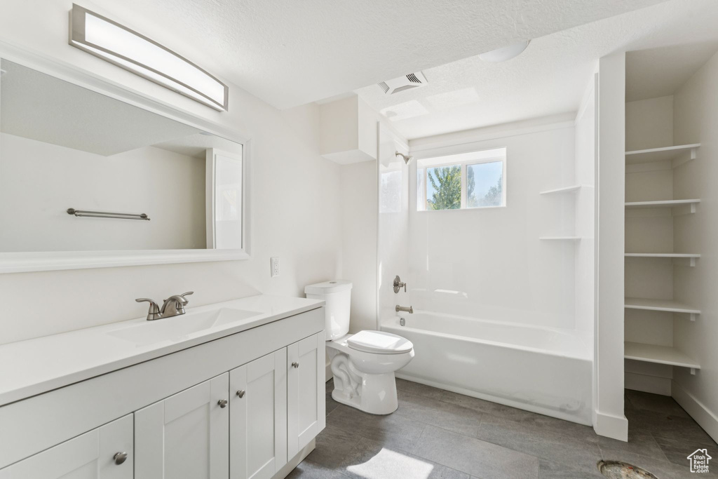 Bathroom with vanity and bathing tub / shower combination