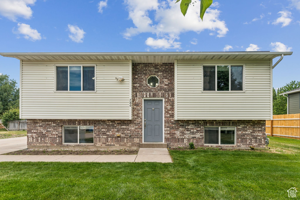 Raised ranch with brick siding