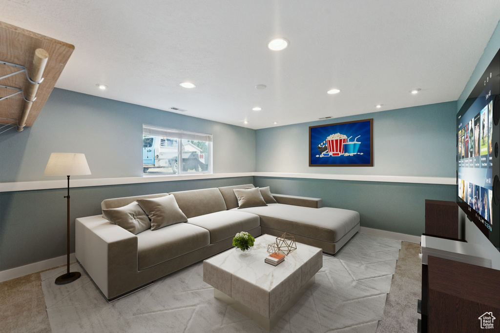 Living area with recessed lighting and baseboards