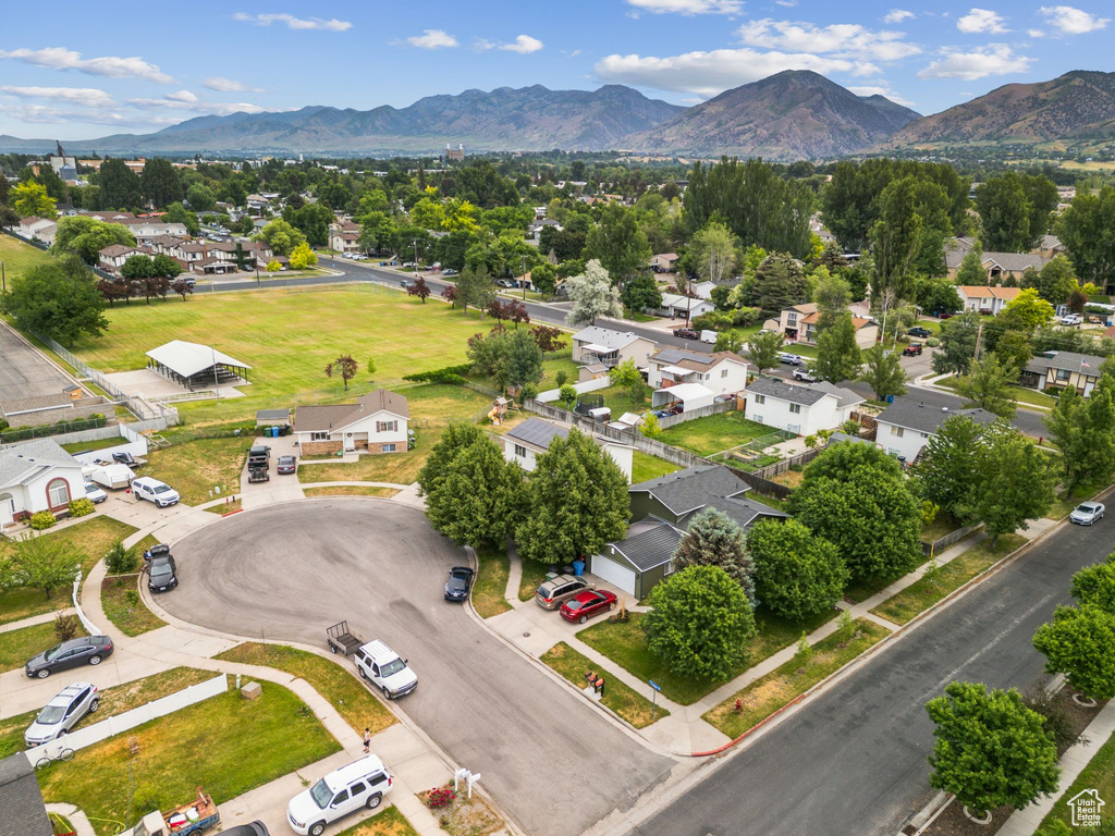 Aerial perspective of suburban area with a mountainous background