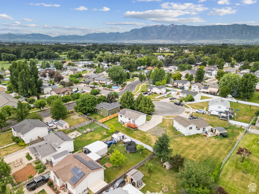 Aerial view of residential area featuring a mountainous background
