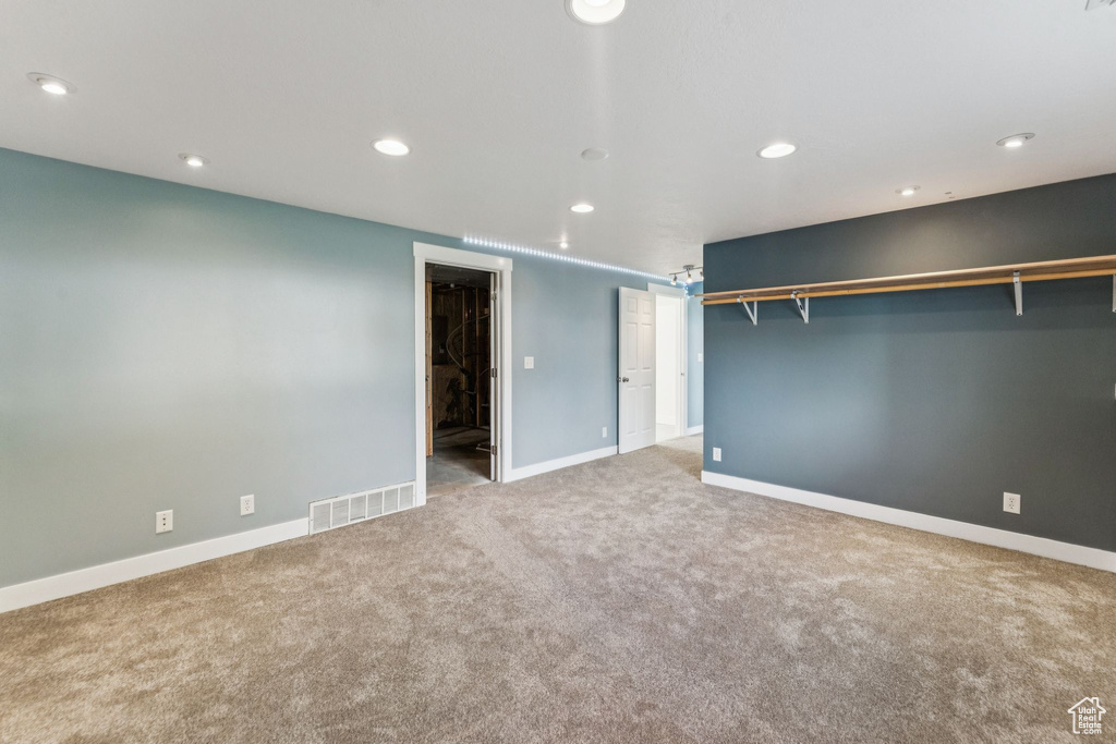 Unfurnished bedroom featuring carpet floors and recessed lighting