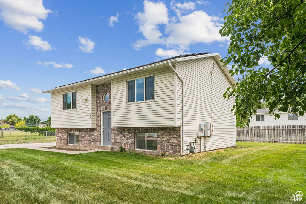 View of front of house featuring brick siding