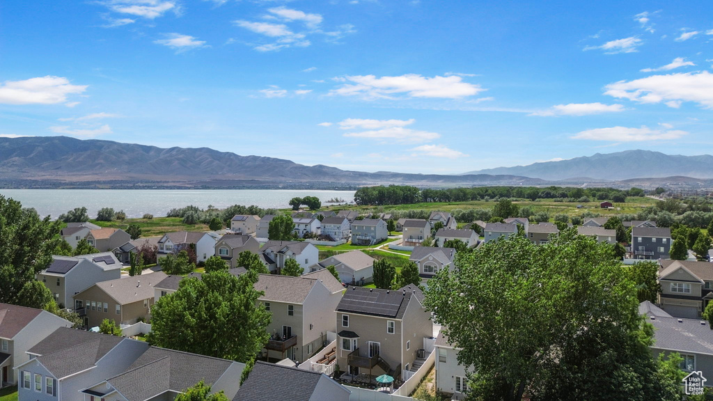 Aerial perspective of suburban area with a water and mountain view