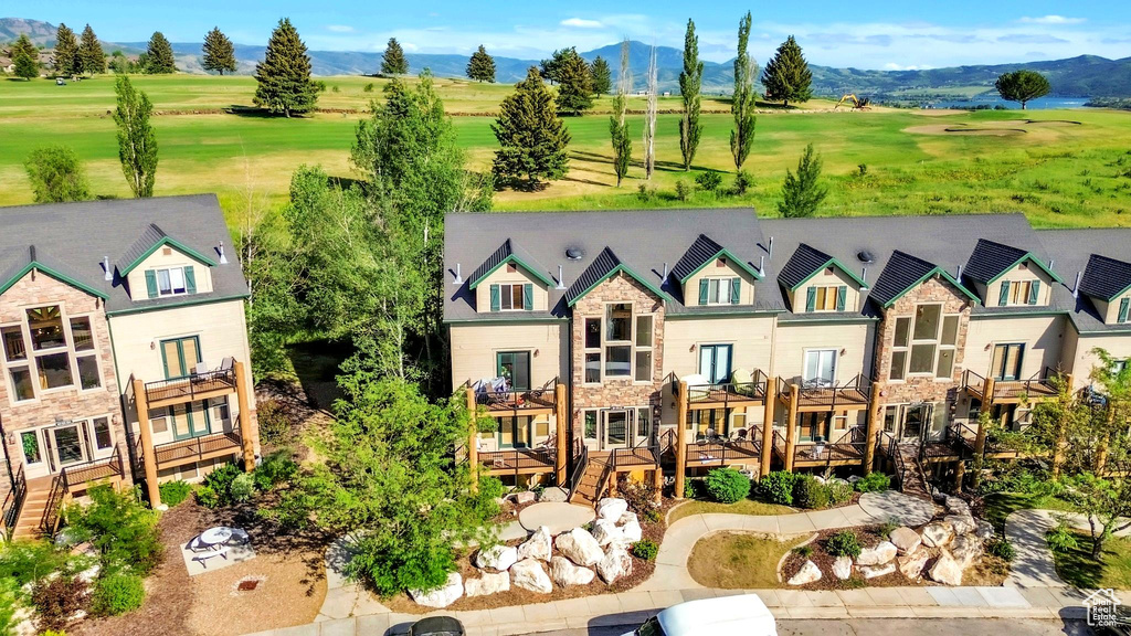 Drone / aerial view of mountains and a local golf course