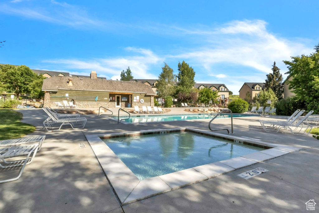 Community pool featuring a patio area