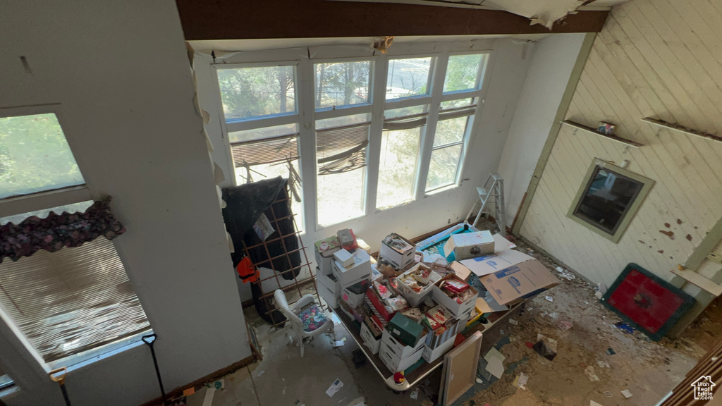 Living room with vaulted ceiling and wooden walls