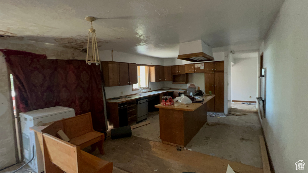 Kitchen with dishwasher, custom range hood, light countertops, and a center island