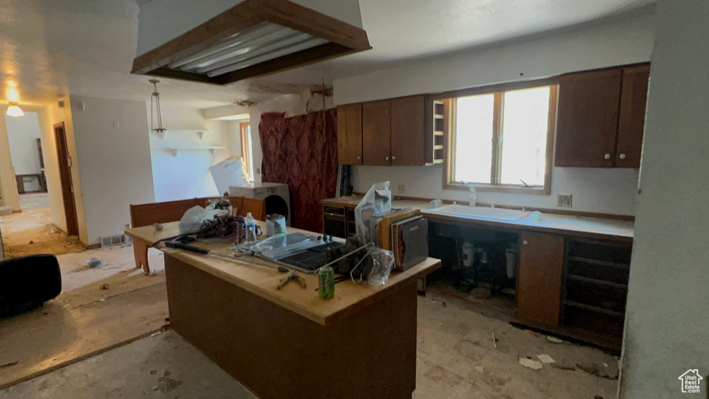 Kitchen featuring a sink and light countertops