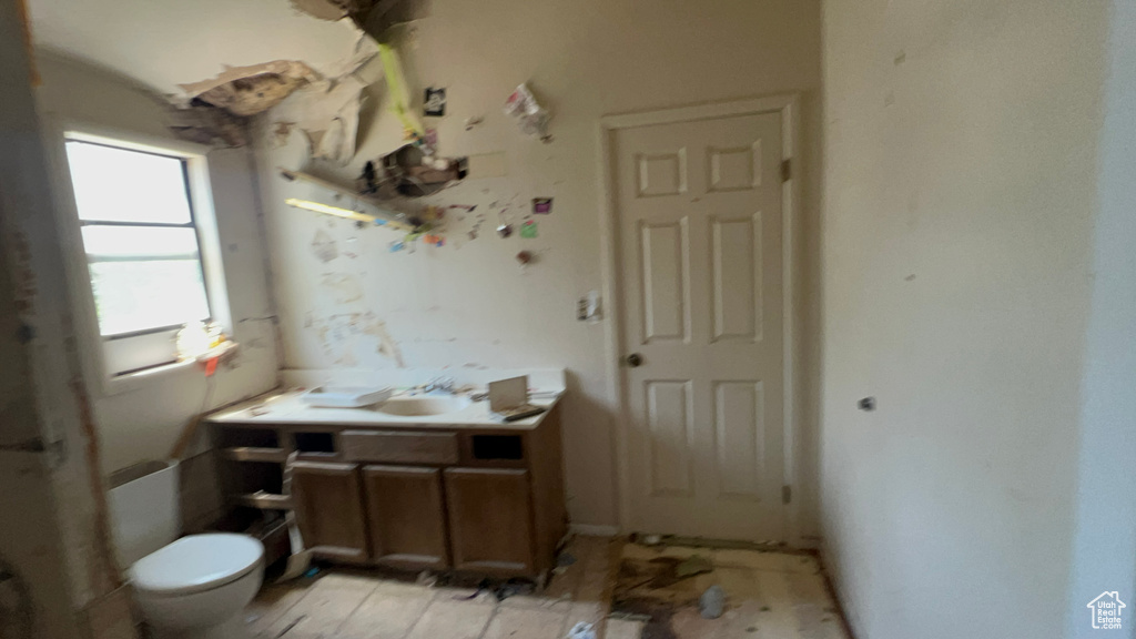 Bathroom featuring vanity and toilet