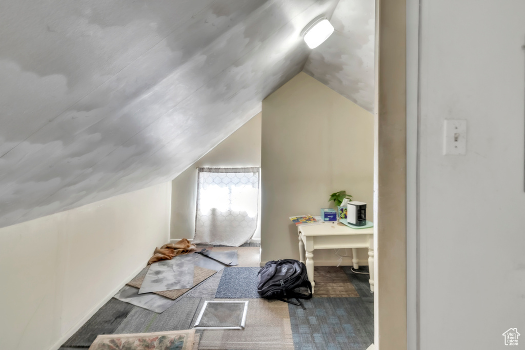 Additional living space featuring lofted ceiling