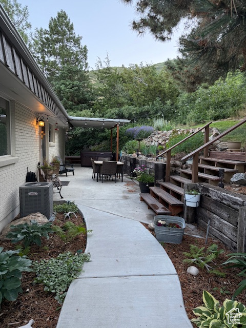 View of patio / terrace with outdoor dining area and stairs