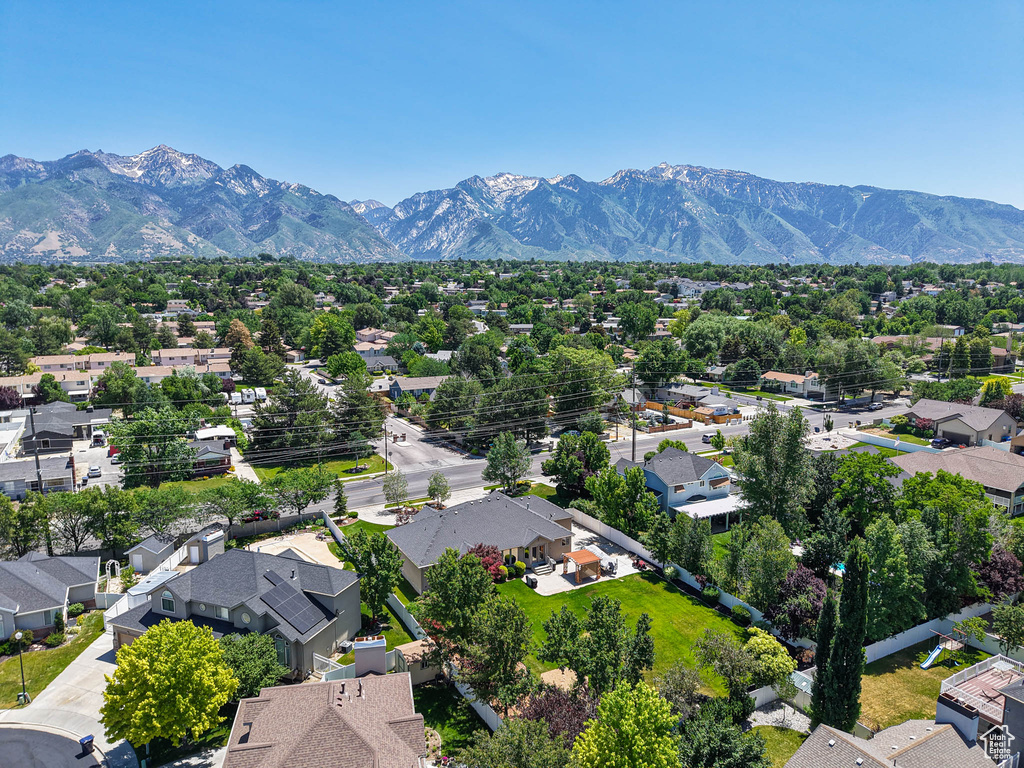 Aerial view of residential area featuring a mountain backdrop